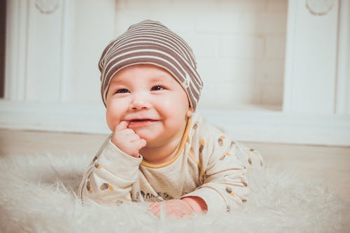 An autism baby smiling on random things